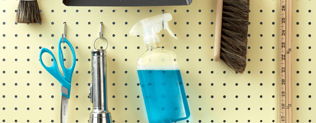 Organised pegboard with hooks, bins, and trays showing efficient storage for home and retail displays