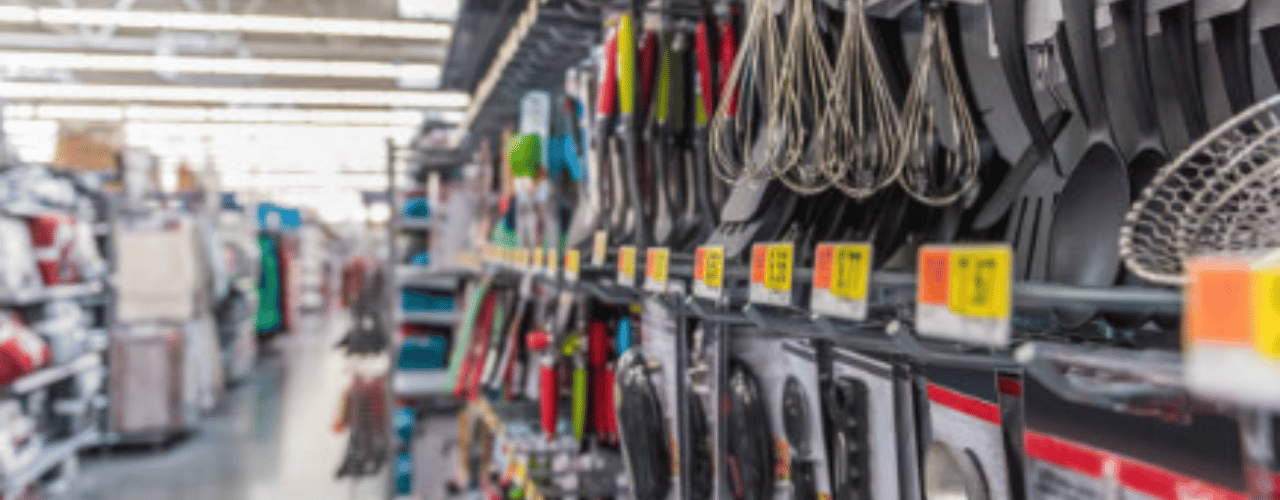 Retail display hooks neatly presenting products on a shop wall panel