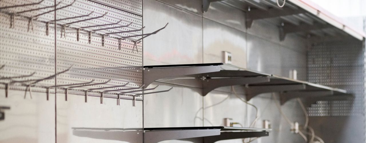 Retail wall display using slatwall euro hooks to organise products clearly