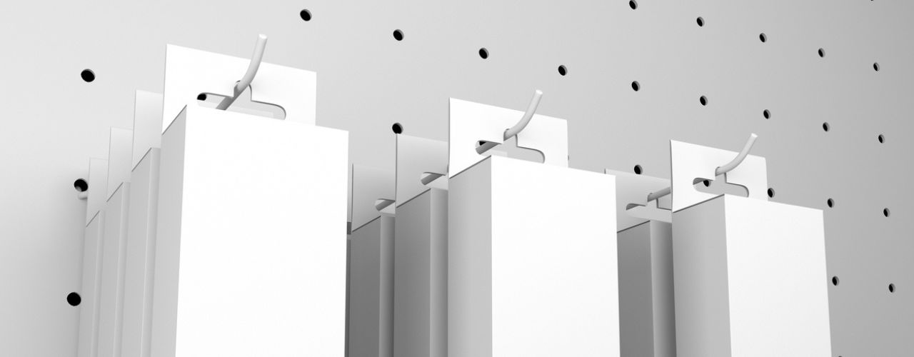 Retail pegboard wall display using hooks to organise products clearly